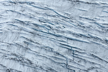 Aerial View of Glacier Ice and Crevasses With Blue Meltwater Channels in BC, Canada Landscape © edb3_16