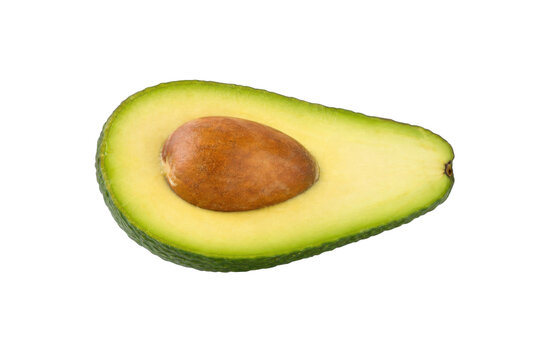 Fresh green avocado half with a large brown seed visible, isolated on a clean white background with soft, even lighting