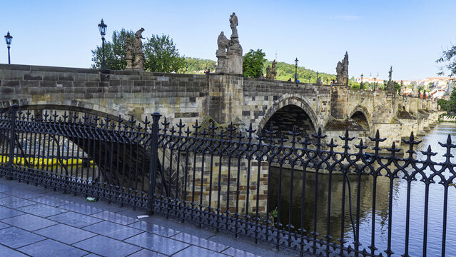 The Charles Bridge is a medieval stone arch bridge that crosses the Vltava River in Prague. It is one of the most iconic landmarks in the city.