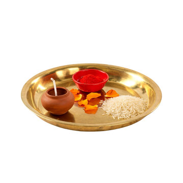 Traditional Brass Pooja Thali with Diya Kumkum Rice and Marigold Petals