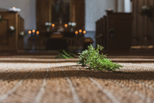 Evergreen Branch on Church Aisle During Christian Funeral Ceremony