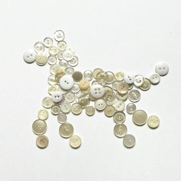 horse-shaped object made from button collage, pony made with buttons, small horse button art, dog-shaped object, decorative illustration made with white buttons