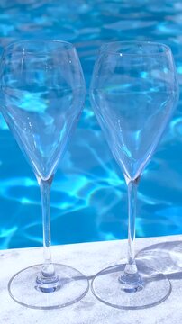 Champagne by the pool. Selective focus.