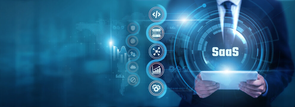 Businessman using tablet analyzing SaaS and software data, monitoring cloud applications, optimizing digital services, improving business efficiency and supporting scalable technology solutions