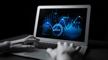 A futuristic robotic hand interacts with a laptop showcasing intricate digital financial data,...