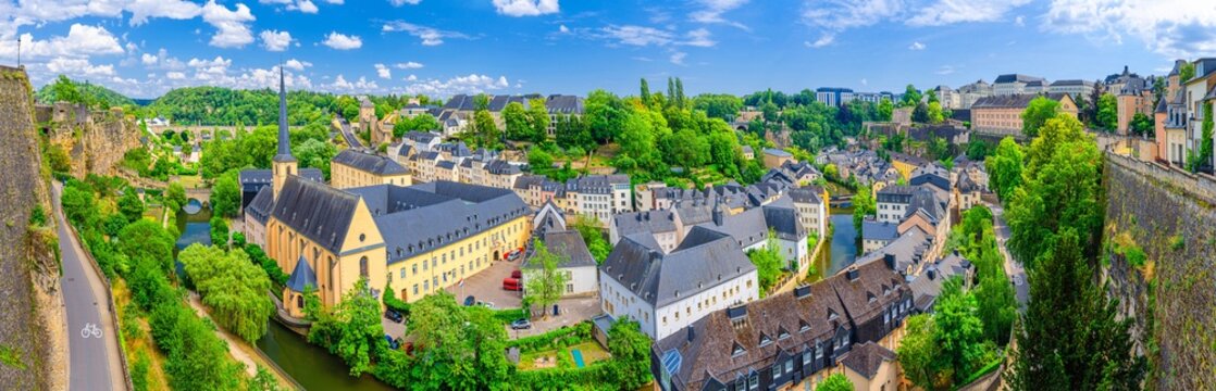 Luxembourg panorama, aerial panoramic view Luxembourg City historic centre, Luxembourg old town Grund district in Alzette valley, Neimenster Abbey, Saint John on Stone catholic Church, Rham Plateau