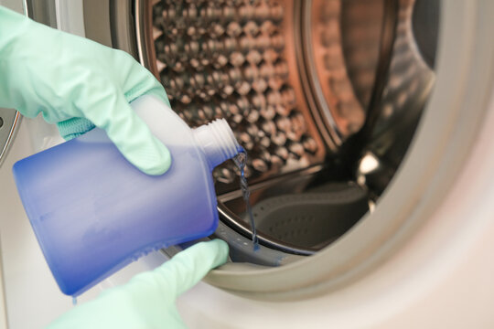 Washing machine cleaning, applying liquid cleaner to the rubber door seal of a front loading washer, household cleaning and appliance maintenance