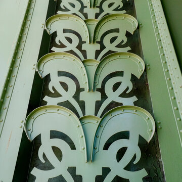Green art nouveau metal ornament with rivets