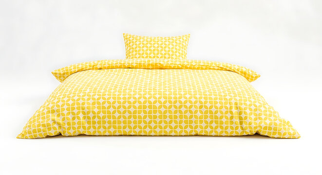 Yellow patterned bedding set with a duvet cover and pillowcase isolated on white background