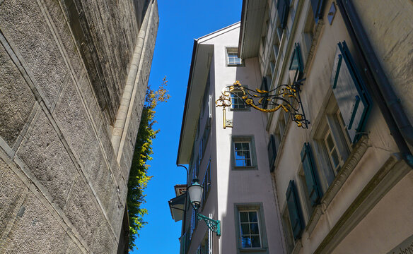 Vintage golden key sign on historic building in Zurich