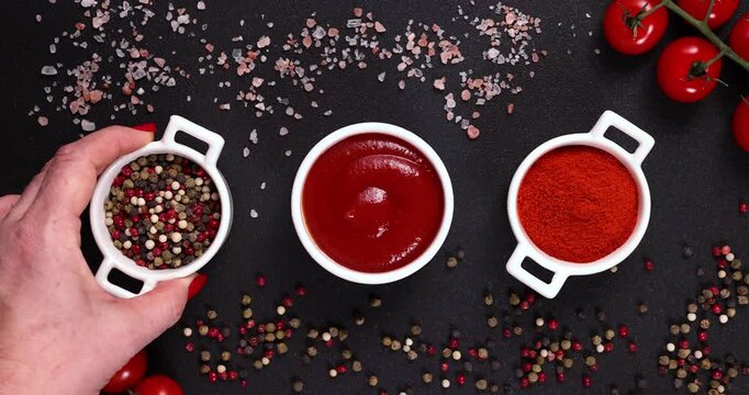 Hand placing bowl of peppercorns for cooking