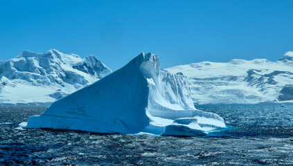 Huge iceberg floating in Charlotte Bay, Antarctica, Antarctic Peninsula. © Mariya