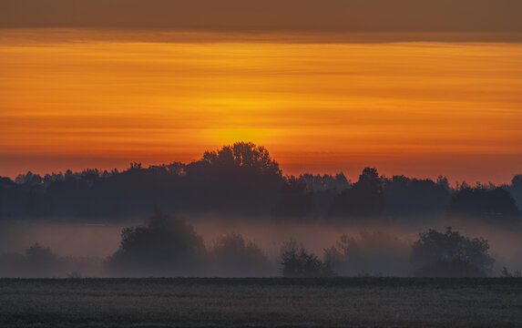 Fields covered in fog in Kernave, Lithuania