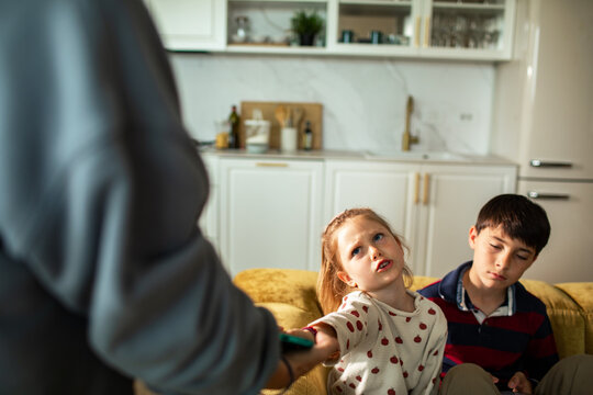 Upset girl as parent takes away smartphone at home