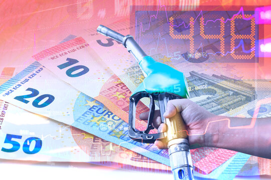 Diesel fuel nozzle over euro banknotes with financial charts, digital market data and price fluctuations. Concept fuel costs, energy market volatility, inflation and rising fuel prices.