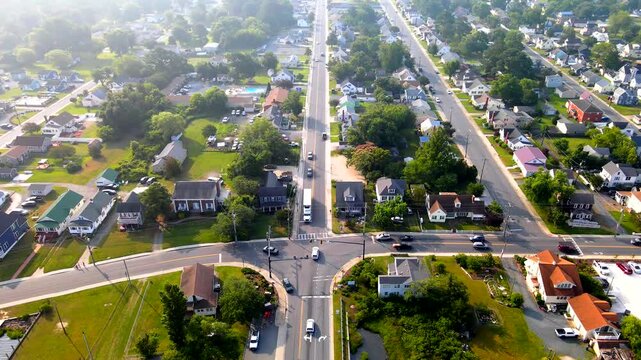 Chincoteague homes and intersecting streets spread beneath a slowly retreating aerial camera.