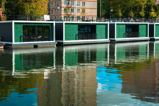 River hotel in Gdansk. Wooden cabins floating on the water surface