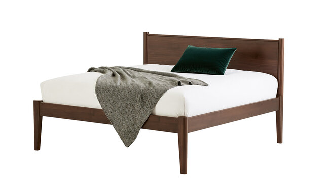 Isolated contemporary wooden bed frame with mattress, green velvet pillow, and gray throw blanket