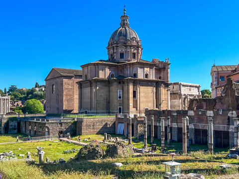 The Roman Forum in Rome, showing the Baroque dome of the church of Santi Luca e Martina in the center, along with the ruins of ancient temples (including columns)