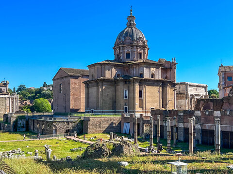 The Roman Forum in Rome, showing the Baroque dome of the church of Santi Luca e Martina in the center, along with the ruins of ancient temples 