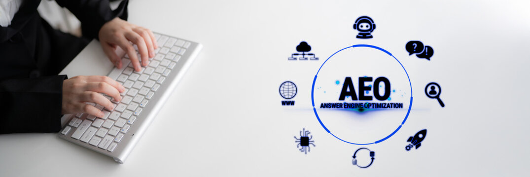 Modern Digital Marketing Concept Featuring Answer Engine Optimization with Hands on Keyboard and Graphic Elements Representing Online Tools and Strategies Fluxor.