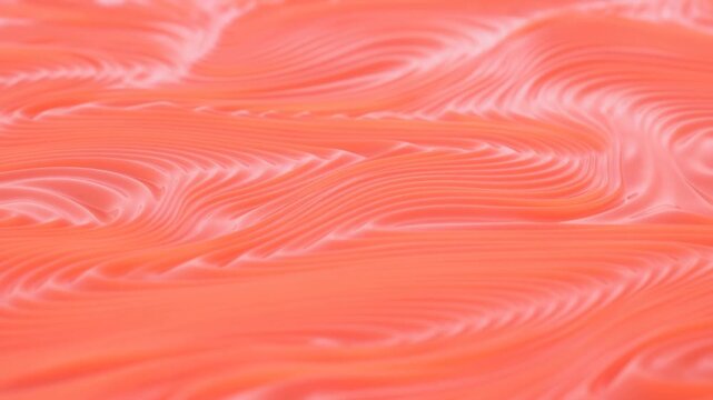 Coral and peach abstract fluid pattern with layered flowing swirls and glossy ripples