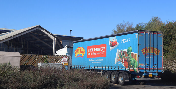 NORWICH, NORFOLK, ENGLAND - SEPTEMBER 19, 2026: Smyths Toys Truck with Pixar Characters and Free Delivery Offer