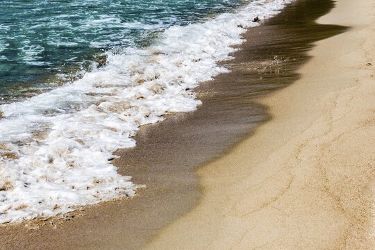 Surf on a sandy beach, Corsica, France