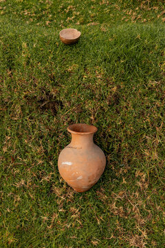 Scenic indigenous ceramic pottery over grass