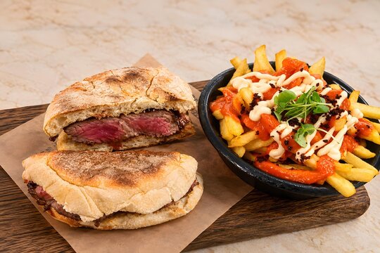 Juicy Steak Sandwich with Loaded French Fries and Creamy Sauce