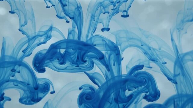 Blue Ink Swirling Patterns Dissolving Inside Clear Water Background