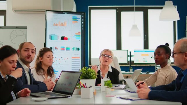Video call, discussion and teamwork with business colleagues seated in modern office during online conference for remote collaboration, project planning, communication and corporate strategy.