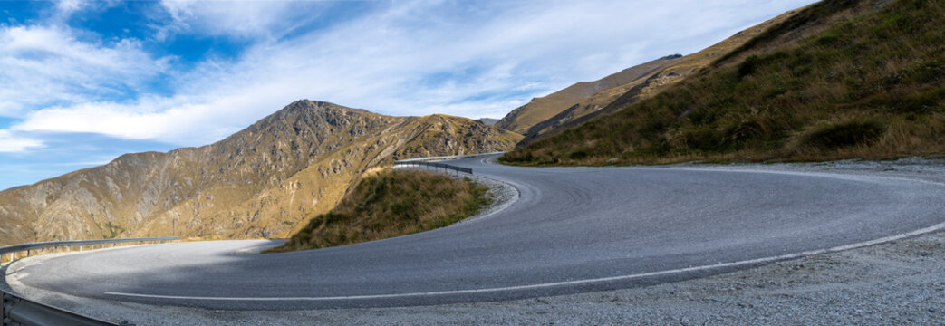 Road background, automotive backplate, switchback hairpin bend panorama on sealed mountain road