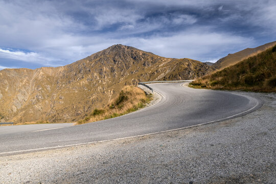 Road background, automotive backplate, switchback hairpin bend on sealed mountain road