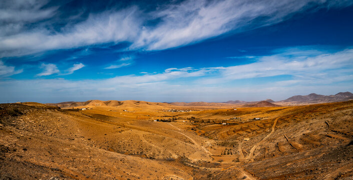 Panoramic Arid Landscape with Rolling Hills in Fuerteventura, spain