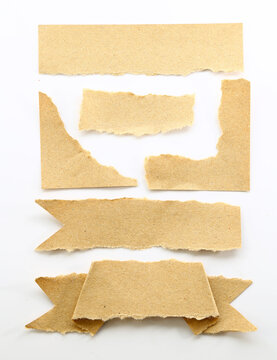 Torn brown kraft paper labels and banner shapes for rustic scrapbooking, collage and handmade designs.