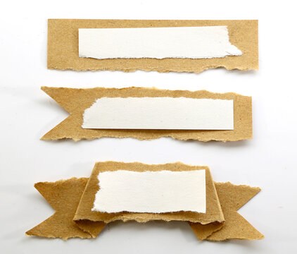Torn kraft paper banners with blank white centers for rustic labels, scrapbooking and creative layouts.