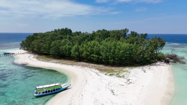 Aerial view of Pulau Cilik island with white sand beach and turquoise water in Karimunjawa, Central Java, Indonesia.