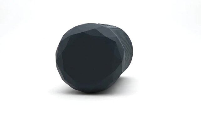 Low poly 3D render of an original portable Bluetooth speaker, compact cylindrical body with faceted dark gray polygon panels, simplified speaker grille, small generic control buttons, balanced proport