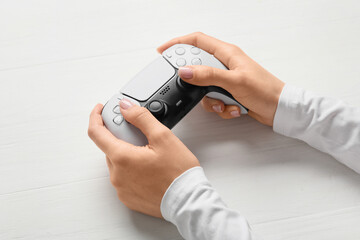 Gaming and entertainment, person holding a modern video game controller for interactive leisure and digital hobby on a clean white background © Pixel-Shot