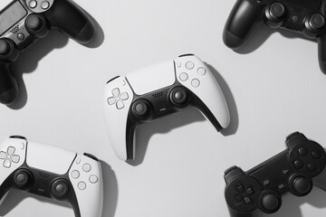 Gaming culture and entertainment, collection of modern video game controllers arranged on a neutral background for esports and digital leisure concepts © Pixel-Shot