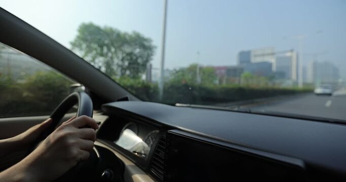 People driving car on the modern city road