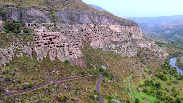 Aerial view of the historic Vardzia cave monastery carved into the mountainside above the Mtkvari River in Gogasheni, Samtskhe-Javakheti, Georgia.