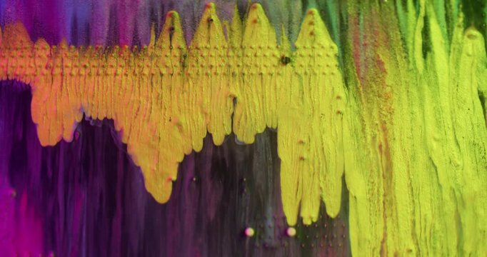 Yellow dye spill. Electronic texture. Defocused blue pink purple colorful ink digital mix water fluid spreading on abstract art background.