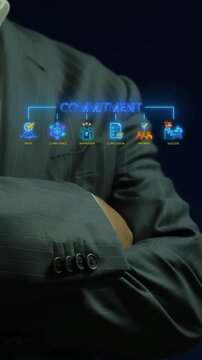 Businessman with crossed arms vertical shot below glowing commitment text and trust values icons. Corporate leadership ethics, executive competence promise, and business success strategy concept.