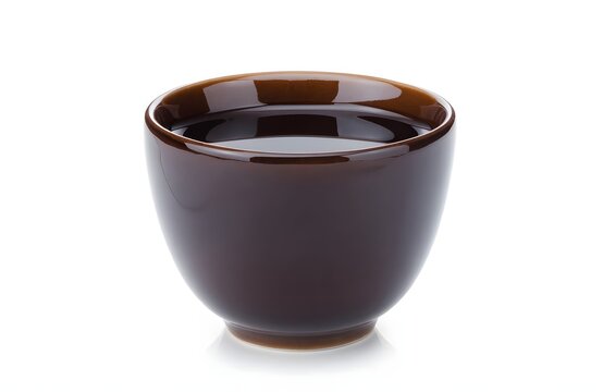 A dark brown ceramic bowl filled