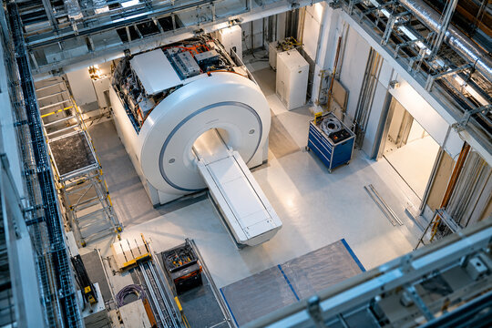 Unbranded MRI equipment showing mri room from above drone view in a modern hospital radiology installation environment with no people. Medical technology image created with Generative AI.