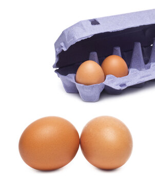 Brown Eggs with Open Purple Carton Isolated on White Background