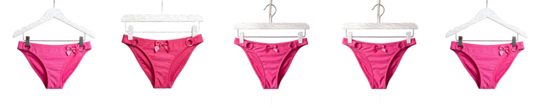 Pink Bikini Bottom Swimwear on Hangers Row Isolated on White Background   