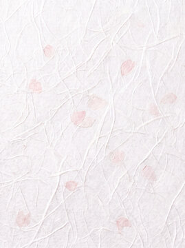 Pure white Washi, a traditional Japanese craft. Handcrafted by artisans, it features delicate watermarks, flower petals, and a rich fiber pattern born from the papermaking process.